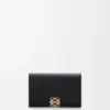 Anagram business cardholder in pebble grained calfskin Black/Gold Anagram business cardholder in pebble grained calfskin Black/Gold