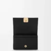 Anagram business cardholder in pebble grained calfskin Black/Gold Anagram business cardholder in pebble grained calfskin Black/Gold