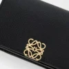 Anagram business cardholder in pebble grained calfskin Black/Gold Anagram business cardholder in pebble grained calfskin Black/Gold