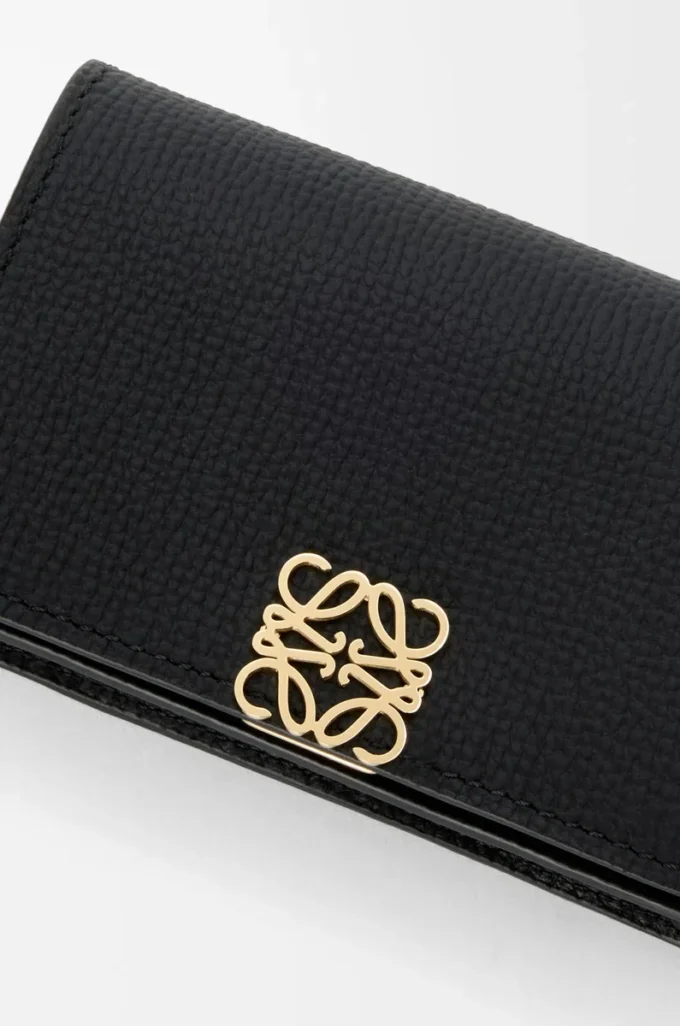 Anagram business cardholder in pebble grained calfskin Black/Gold Anagram business cardholder in pebble grained calfskin Black/Gold