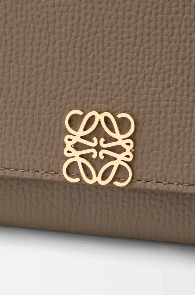 Anagram continental wallet in pebble grained calfskin Taupe