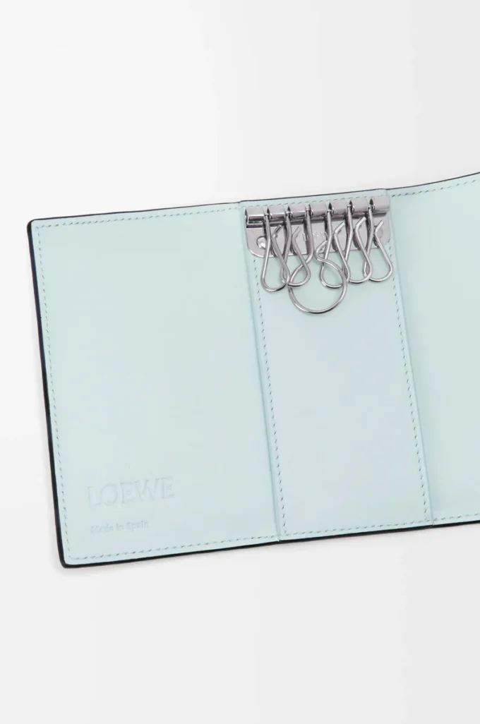 Anagram key case in pebble grained calfskin Frozen Anagram key case in pebble grained calfskin Frozen