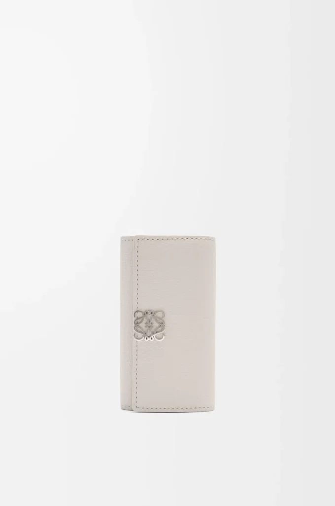 Anagram key case in pebble grained calfskin Light Ghost