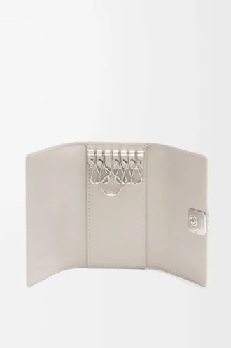 Anagram key case in pebble grained calfskin Light Ghost
