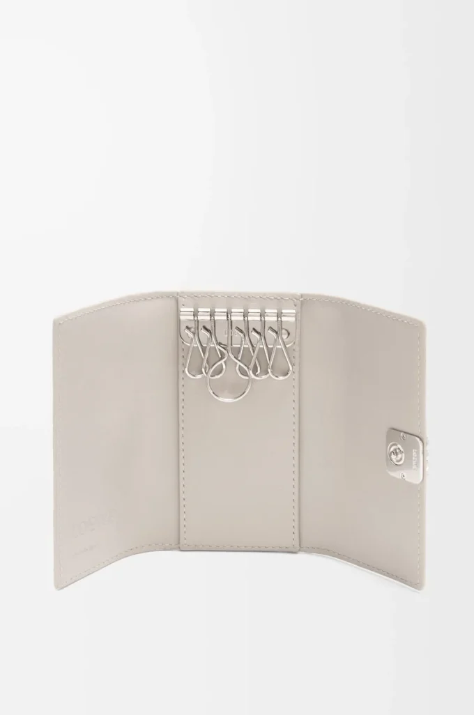 Anagram key case in pebble grained calfskin Light Ghost