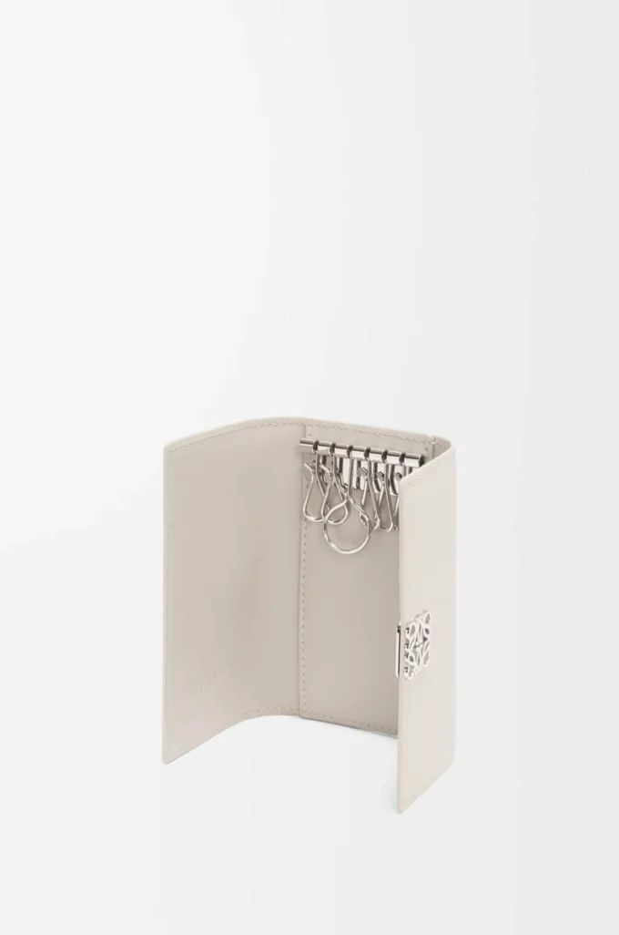 Anagram key case in pebble grained calfskin Light Ghost