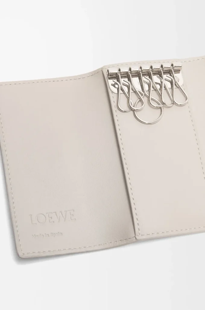 Anagram key case in pebble grained calfskin Light Ghost