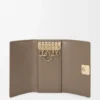 Anagram key case in pebble grained calfskin Taupe Anagram key case in pebble grained calfskin Taupe