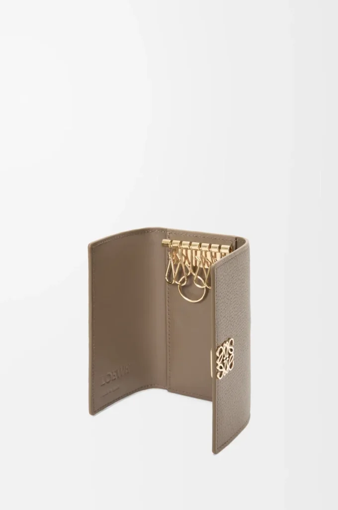 Anagram key case in pebble grained calfskin Taupe Anagram key case in pebble grained calfskin Taupe