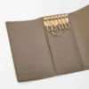 Anagram key case in pebble grained calfskin Taupe Anagram key case in pebble grained calfskin Taupe