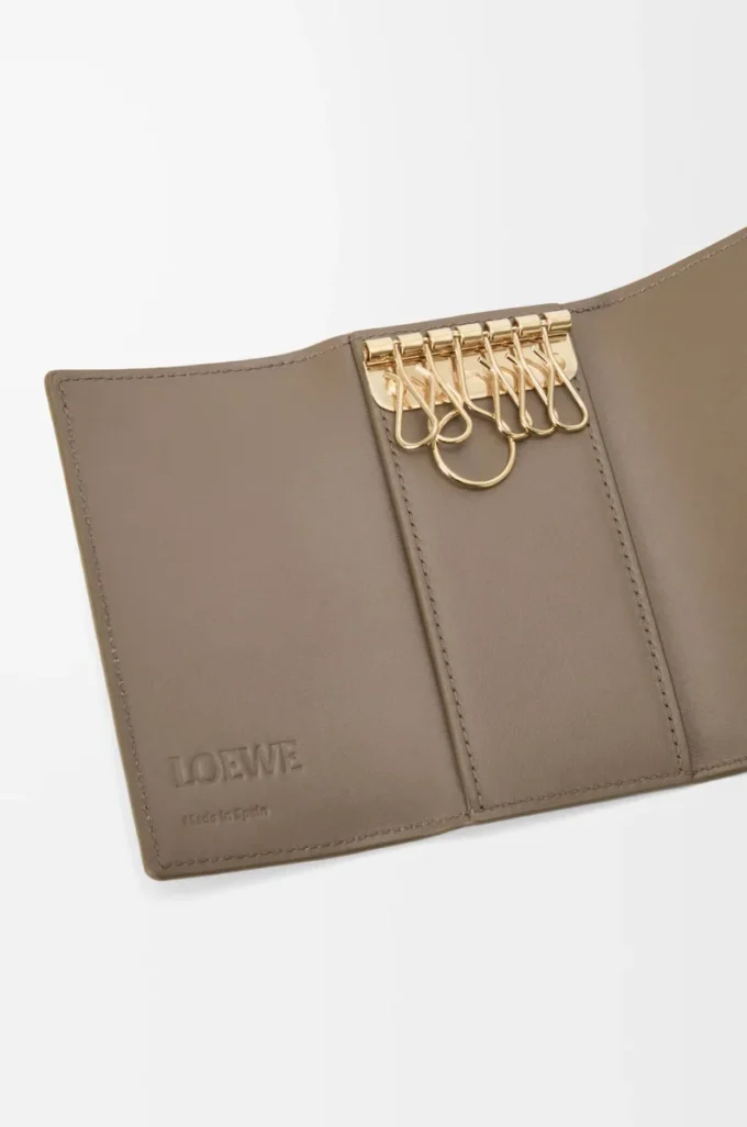 Anagram key case in pebble grained calfskin Taupe Anagram key case in pebble grained calfskin Taupe