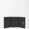 Anagram trifold wallet in pebble grained calfskin Black