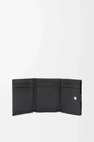 Anagram trifold wallet in pebble grained calfskin Black