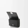 Anagram trifold wallet in pebble grained calfskin Black