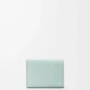 Anagram trifold wallet in pebble grained calfskin Frozen