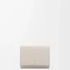 Anagram trifold wallet in pebble grained calfskin Light Ghost Anagram trifold wallet in pebble grained calfskin Light Ghost