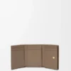 Anagram trifold wallet in pebble grained calfskin Taupe