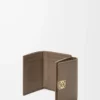 Anagram trifold wallet in pebble grained calfskin Taupe