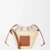 Drawstring bucket in palm leaf and calfskin Natural/Tan Drawstring bucket in palm leaf and calfskin Natural/Tan
