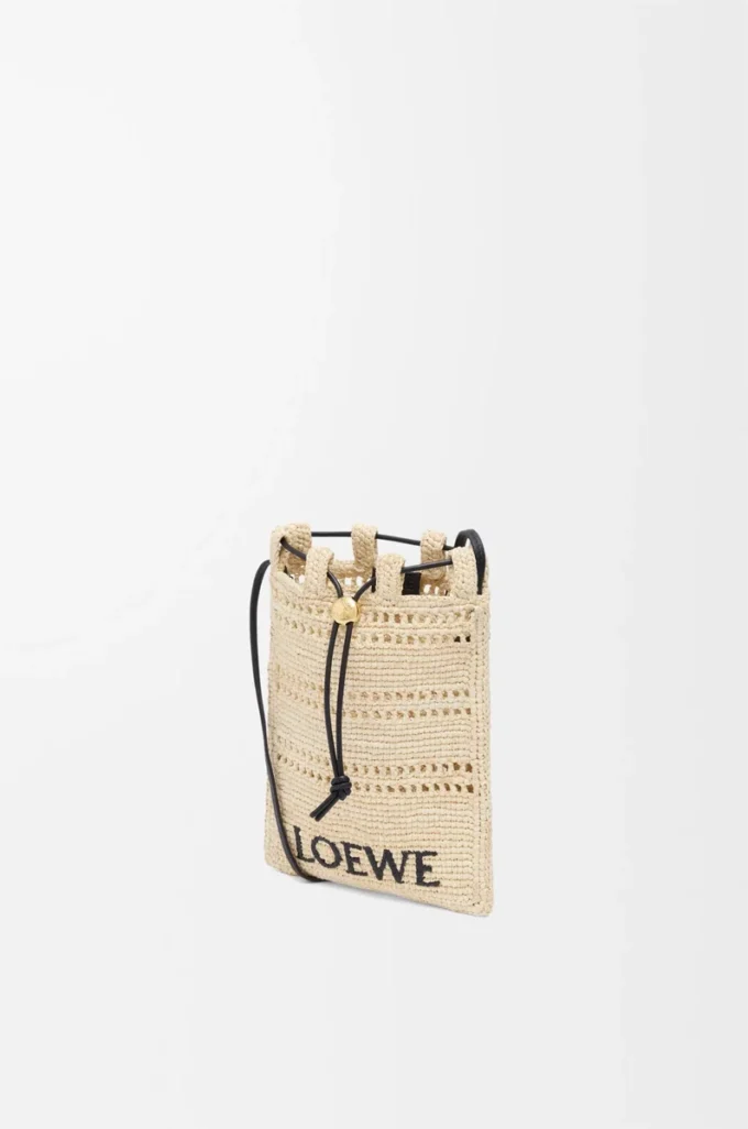 Drawstring pocket in raffia Natural/Black Drawstring pocket in raffia Natural/Black