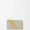 Knot coin cardholder in shiny nappa calfskin Shell Grey/Dandelion Knot coin cardholder in shiny nappa calfskin Shell Grey/Dandelion