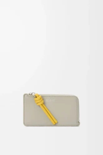 Knot coin cardholder in shiny nappa calfskin Shell Grey/Dandelion