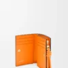 Knot compact wallet in shiny nappa calfskin Black/Bright Orange Knot compact wallet in shiny nappa calfskin Black/Bright Orange