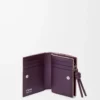 Knot compact wallet in shiny nappa calfskin Clay/Plum Knot compact wallet in shiny nappa calfskin Clay/Plum