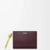 Knot compact wallet in shiny nappa calfskin Dark Burgundy/Light Citrine Knot compact wallet in shiny nappa calfskin Dark Burgundy/Light Citrine