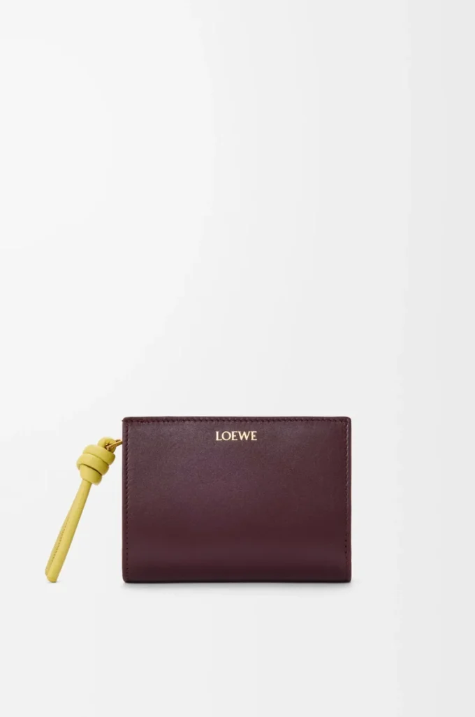 Knot compact wallet in shiny nappa calfskin Dark Burgundy/Light Citrine Knot compact wallet in shiny nappa calfskin Dark Burgundy/Light Citrine