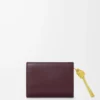 Knot compact wallet in shiny nappa calfskin Dark Burgundy/Light Citrine Knot compact wallet in shiny nappa calfskin Dark Burgundy/Light Citrine