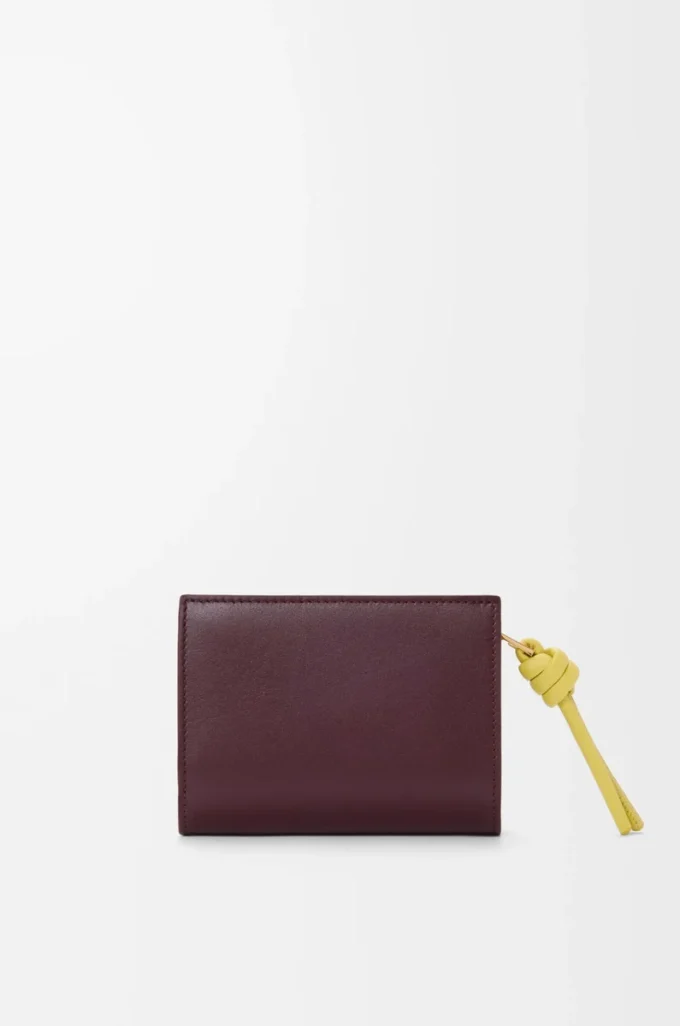 Knot compact wallet in shiny nappa calfskin Dark Burgundy/Light Citrine Knot compact wallet in shiny nappa calfskin Dark Burgundy/Light Citrine