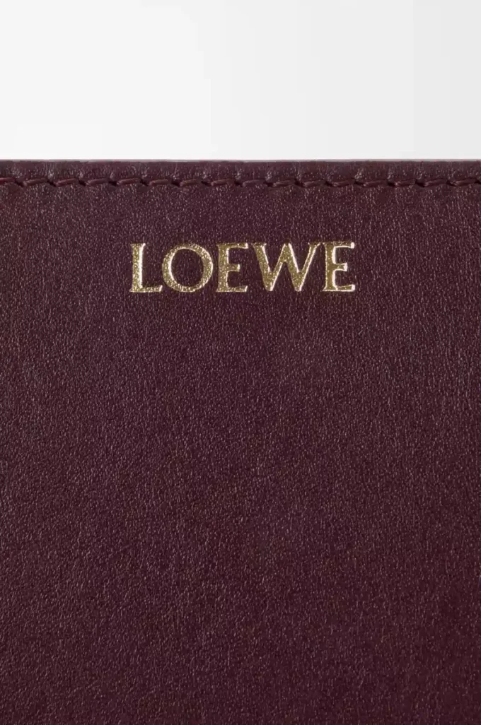 Knot compact wallet in shiny nappa calfskin Dark Burgundy/Light Citrine Knot compact wallet in shiny nappa calfskin Dark Burgundy/Light Citrine