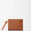 Knot compact wallet in shiny nappa calfskin Tan/Papaya Knot compact wallet in shiny nappa calfskin Tan/Papaya