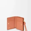 Knot compact wallet in shiny nappa calfskin Tan/Papaya Knot compact wallet in shiny nappa calfskin Tan/Papaya