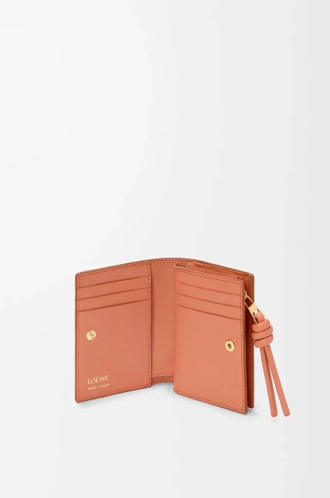 Knot compact wallet in shiny nappa calfskin Tan/Papaya Knot compact wallet in shiny nappa calfskin Tan/Papaya