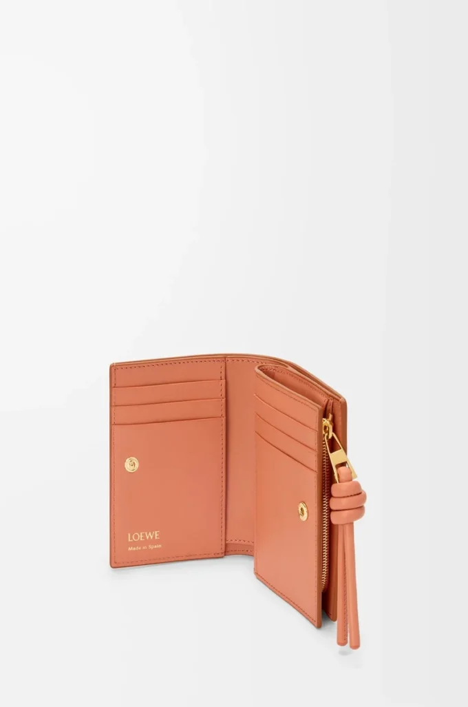 Knot compact wallet in shiny nappa calfskin Tan/Papaya Knot compact wallet in shiny nappa calfskin Tan/Papaya