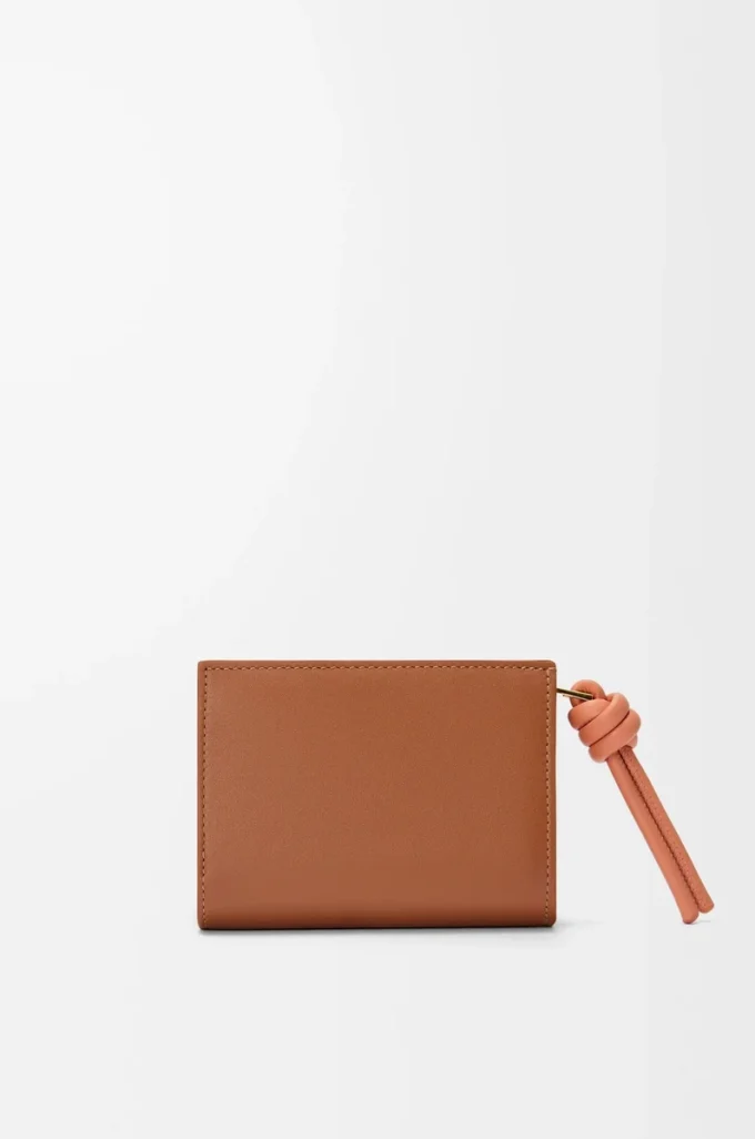 Knot compact wallet in shiny nappa calfskin Tan/Papaya Knot compact wallet in shiny nappa calfskin Tan/Papaya
