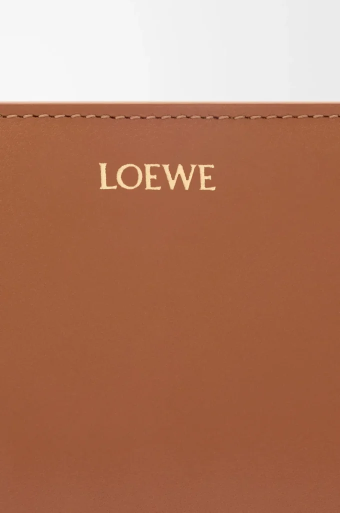 Knot compact wallet in shiny nappa calfskin Tan/Papaya Knot compact wallet in shiny nappa calfskin Tan/Papaya
