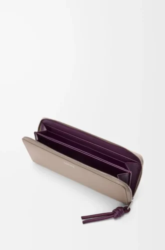 Knot zip around wallet in shiny nappa calfskin Clay/Plum