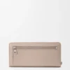 Knot zip around wallet in shiny nappa calfskin Clay/Plum