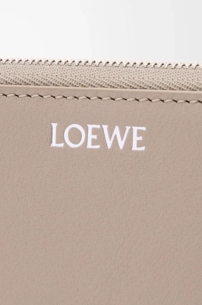 Knot zip around wallet in shiny nappa calfskin Clay/Plum