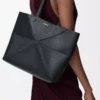 Medium horizontal Puzzle Fold tote in soft grained calfskin Black Medium horizontal Puzzle Fold tote in soft grained calfskin Black