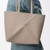 Medium horizontal Puzzle Fold tote in soft grained calfskin Clay Medium horizontal Puzzle Fold tote in soft grained calfskin Clay