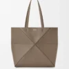 Medium horizontal Puzzle Fold tote in soft grained calfskin Taupe Medium horizontal Puzzle Fold tote in soft grained calfskin Taupe