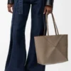 Medium horizontal Puzzle Fold tote in soft grained calfskin Taupe Medium horizontal Puzzle Fold tote in soft grained calfskin Taupe
