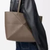 Medium horizontal Puzzle Fold tote in soft grained calfskin Taupe Medium horizontal Puzzle Fold tote in soft grained calfskin Taupe