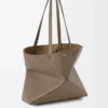 Medium horizontal Puzzle Fold tote in soft grained calfskin Taupe Medium horizontal Puzzle Fold tote in soft grained calfskin Taupe