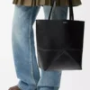 Medium Puzzle Fold tote in shiny calfskin Black Medium Puzzle Fold tote in shiny calfskin Black