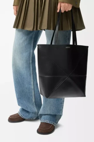Medium Puzzle Fold tote in shiny calfskin Black